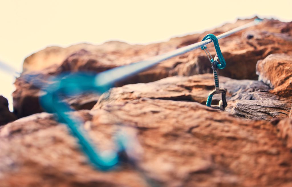 A climbing rope hooked to a mountain wall