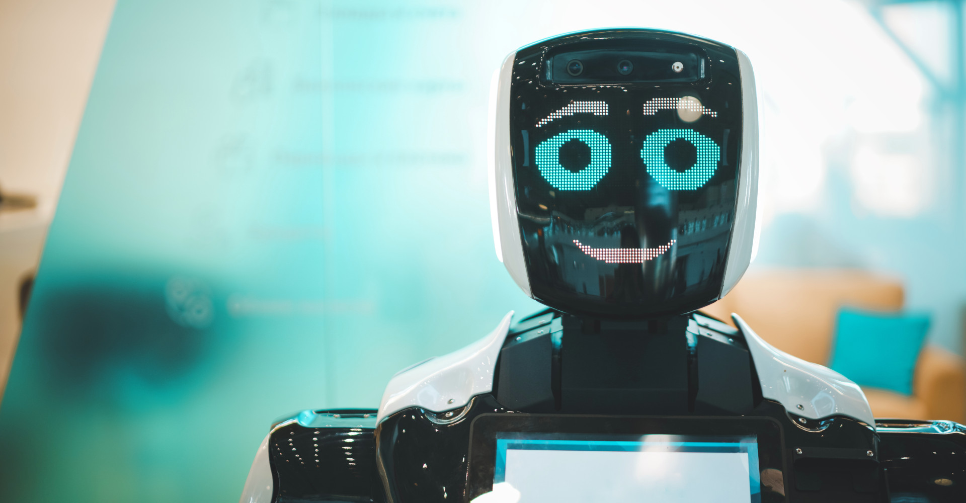 A Robot holds a tablet in his hand